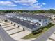 Aerial view showcasing an inviting neighborhood with garages and lush landscaping at 1324 Painted Bunting Ave, Oakland, FL 34787