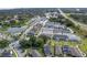 Overhead image of a neighborhood featuring houses surrounding a lake and easy access to the highway at 1324 Painted Bunting Ave, Oakland, FL 34787