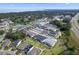 Wide aerial view of the community with well-planned neighborhood layout and a nearby lake at 1324 Painted Bunting Ave, Oakland, FL 34787