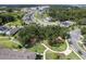 Aerial view showcases the Longleaf at Oakland community with lush landscaping, homes, and a playground at 1324 Painted Bunting Ave, Oakland, FL 34787