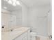 Clean bathroom featuring an undermount sink, vanity and combination tub shower at 1324 Painted Bunting Ave, Oakland, FL 34787