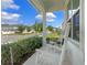 Relaxing front porch with white rocking chairs overlooking the neighborhood street at 1324 Painted Bunting Ave, Oakland, FL 34787