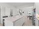 Kitchen with large island, stainless appliances, and open layout into living areas at 1324 Painted Bunting Ave, Oakland, FL 34787