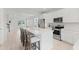 Stylish kitchen with stainless appliances, island seating and view into Gathering room at 1324 Painted Bunting Ave, Oakland, FL 34787