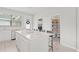 Spacious kitchen island with breakfast bar and a view of the pantry and back entrance at 1324 Painted Bunting Ave, Oakland, FL 34787