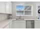 Modern kitchen featuring stainless steel appliances, stylish backsplash, and bright natural light at 1324 Painted Bunting Ave, Oakland, FL 34787