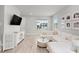 A modern living room features stylish decor, a large window, and ample seating for relaxation at 1324 Painted Bunting Ave, Oakland, FL 34787