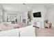 Bright, open-concept living room featuring modern decor and light wood floors at 1324 Painted Bunting Ave, Oakland, FL 34787