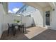 Private outdoor patio area perfect for dining al fresco, complete with privacy fence and covered space at 1324 Painted Bunting Ave, Oakland, FL 34787