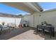 Charming patio features brick pavers, a seating area, and a table with chairs, perfect for outdoor entertaining at 1324 Painted Bunting Ave, Oakland, FL 34787