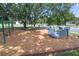 Community playground with swings and other modern play equipment in a green space perfect for families at 1324 Painted Bunting Ave, Oakland, FL 34787