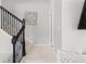 Staircase featuring decorative iron railings and carpeted steps at 1324 Painted Bunting Ave, Oakland, FL 34787