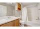 Well-lit bathroom features vanity with generous countertop and a tub at 1461 Sothell St, The Villages, FL 32162