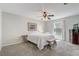Serene bedroom with neutral tones, ceiling fan, and ample natural light at 1461 Sothell St, The Villages, FL 32162