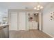 Convenient laundry area with washer, dryer, and storage shelves at 1461 Sothell St, The Villages, FL 32162