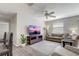 Comfortable living room with sofa, chairs, and large screen TV at 1461 Sothell St, The Villages, FL 32162