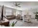 Open concept living area with view of dining room and access to outdoor lanai at 1461 Sothell St, The Villages, FL 32162