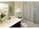 Bright bathroom featuring a single sink with white countertop, and shower-tub combo at 1577 Mulligan Blvd, Davenport, FL 33896