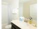 Bathroom featuring a single sink with white countertop, and shower-tub combo at 1577 Mulligan Blvd, Davenport, FL 33896