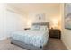 Inviting bedroom features patterned bedding, soft lighting, and comfortable accommodations at 1577 Mulligan Blvd, Davenport, FL 33896