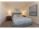 Charming bedroom with nautical themed artwork, comfortable bedding and warm lighting at 1577 Mulligan Blvd, Davenport, FL 33896