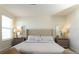Well-lit bedroom with large bed, bedside tables, and mirrors at 1577 Mulligan Blvd, Davenport, FL 33896