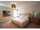 Calming bedroom with plush carpeting, neutral tones, and a king-sized bed at 1577 Mulligan Blvd, Davenport, FL 33896
