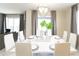 Dining room with table, chairs, view to outside, and modern decor at 1577 Mulligan Blvd, Davenport, FL 33896