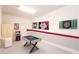 Finished game room with a small pool table and dart board for entertainment at 1577 Mulligan Blvd, Davenport, FL 33896