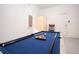 Brightly lit game room featuring a pool table and small arcade game at 1577 Mulligan Blvd, Davenport, FL 33896