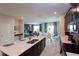 Kitchen island with view of the kitchen, dining room, and living room in an open concept floor plan at 1577 Mulligan Blvd, Davenport, FL 33896