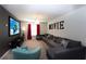 Entertainment room with oversized seating, large movie screen, and cozy atmosphere at 1577 Mulligan Blvd, Davenport, FL 33896