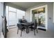 Outdoor patio area with grill, dining table, and screened-in porch access at 1577 Mulligan Blvd, Davenport, FL 33896