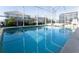 Refreshing pool and spa with a screened enclosure for privacy and enjoyment at 1577 Mulligan Blvd, Davenport, FL 33896