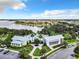 Aerial view of community amenities with a pool and lake backdrop, offering picturesque recreation and relaxation at 16675 Otterchase Ln, Winter Garden, FL 34787