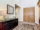 Elegant foyer with wood floors, high ceilings, large front doors, modern decor, and an arched doorway at 16675 Otterchase Ln, Winter Garden, FL 34787