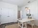 Functional home office space with a large desk, storage shelves, and double door access at 16675 Otterchase Ln, Winter Garden, FL 34787