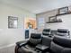 Comfortable home theater featuring leather reclining seats and built-in beverage cooler for an immersive viewing experience at 16675 Otterchase Ln, Winter Garden, FL 34787