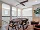 Spacious loft featuring a poker table with seating overlooking the lower level, perfect for a game night at 16675 Otterchase Ln, Winter Garden, FL 34787