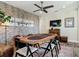 Stylish loft featuring a poker table, brick wall, and a large TV creating a great space for relaxation and entertainment at 16675 Otterchase Ln, Winter Garden, FL 34787