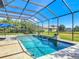Inviting screened pool area with elegant fountains, providing a serene and private outdoor retreat at 16675 Otterchase Ln, Winter Garden, FL 34787