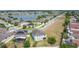 Aerial view of the neighborhood showing a beautiful pond and multiple houses at 1671 Thetford Cir, Orlando, FL 32824
