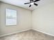 Neutral bedroom with tile flooring, a ceiling fan, and a window that provides plenty of light at 1671 Thetford Cir, Orlando, FL 32824