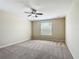 Neutral bedroom with carpet flooring, ceiling fan, and bright natural light from a window at 1671 Thetford Cir, Orlando, FL 32824