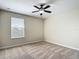 Bedroom with a ceiling fan, window with blinds, and neutral-toned walls at 1671 Thetford Cir, Orlando, FL 32824