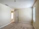 Bedroom with a window, carpeted flooring, and access to the ensuite bathroom at 1671 Thetford Cir, Orlando, FL 32824