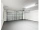 Spacious garage with gray painted floor, white walls, and an insulated garage door at 1671 Thetford Cir, Orlando, FL 32824