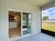 Screened lanai with sliding glass door providing kitchen view and backyard access at 1671 Thetford Cir, Orlando, FL 32824