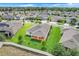 Aerial view of the home featuring a well-maintained lawn and covered patio at 1706 Lake Sims Pkwy, Ocoee, FL 34761