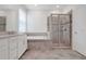 Luxurious bathroom features soaking tub, shower, and double vanity at 1706 Lake Sims Pkwy, Ocoee, FL 34761